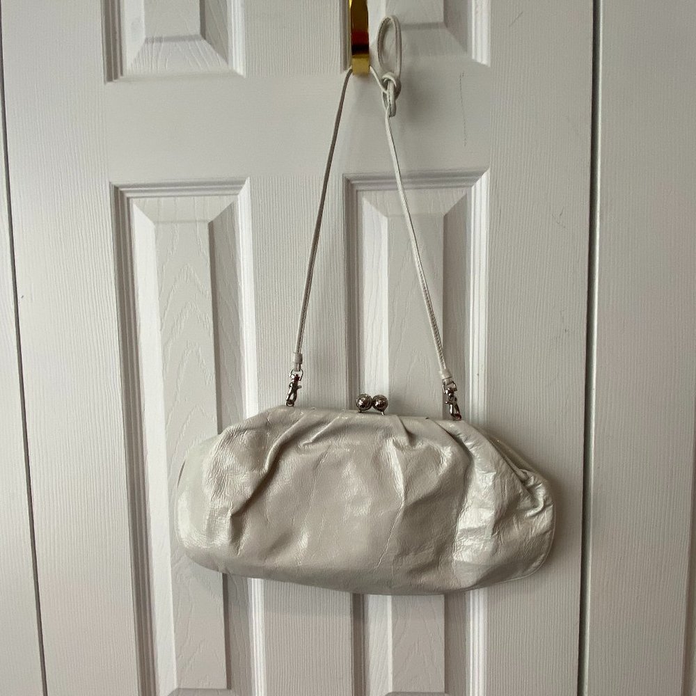 Franchi shoulder bag turns clutch
